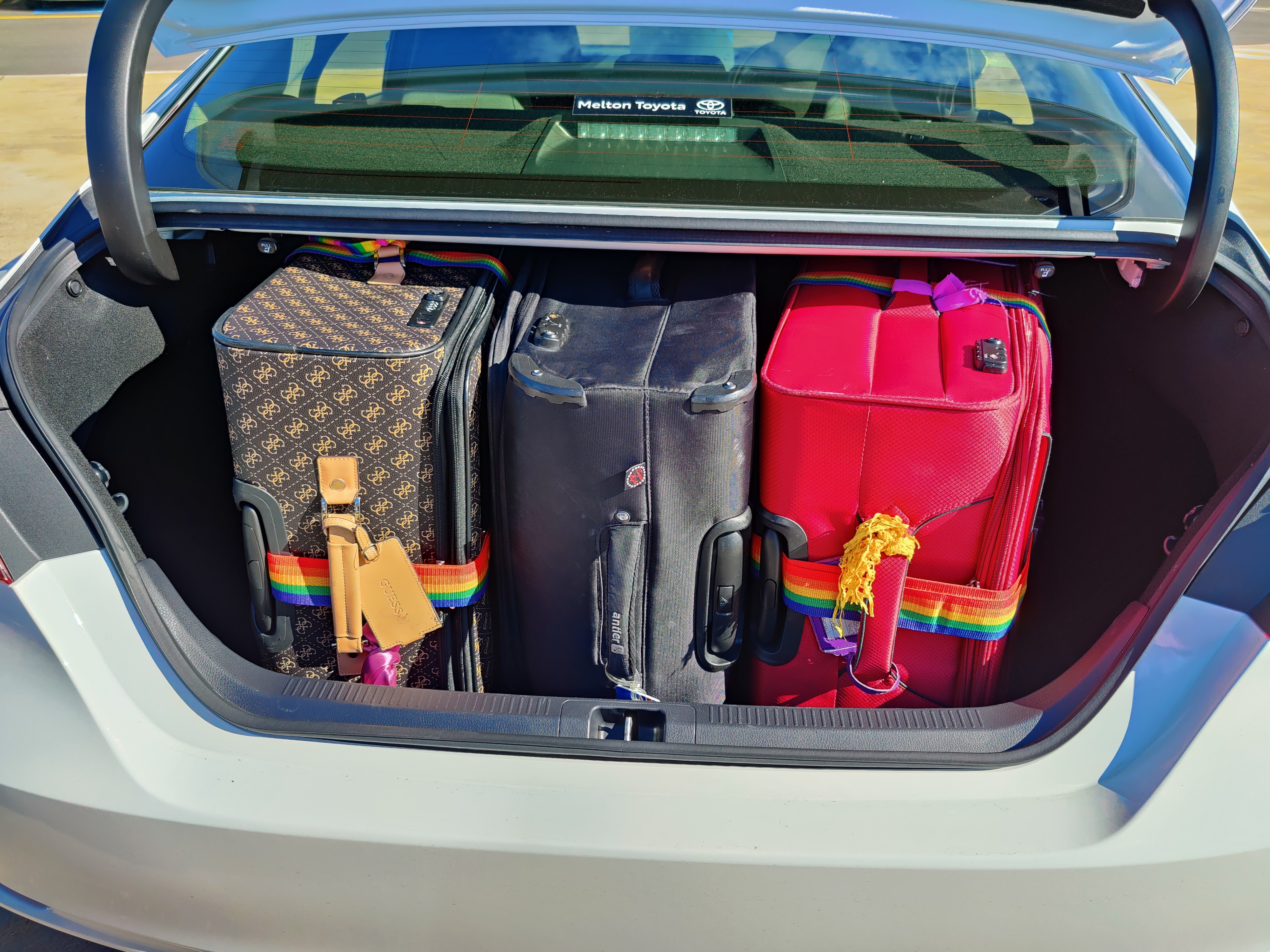 image of 3 suitcases in the boot of a Camry
