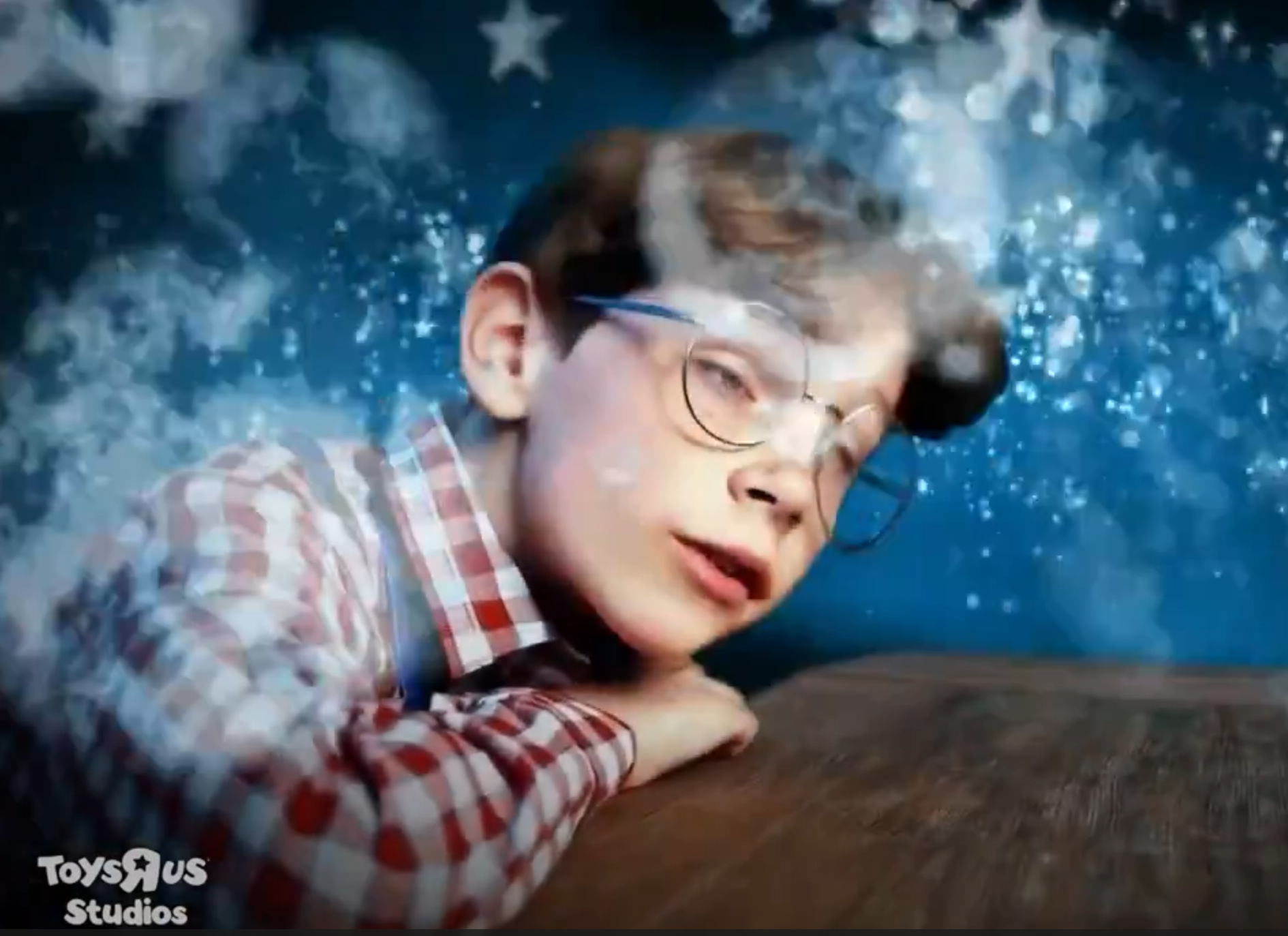 still frame from the commercial of a child who looks slightly melted