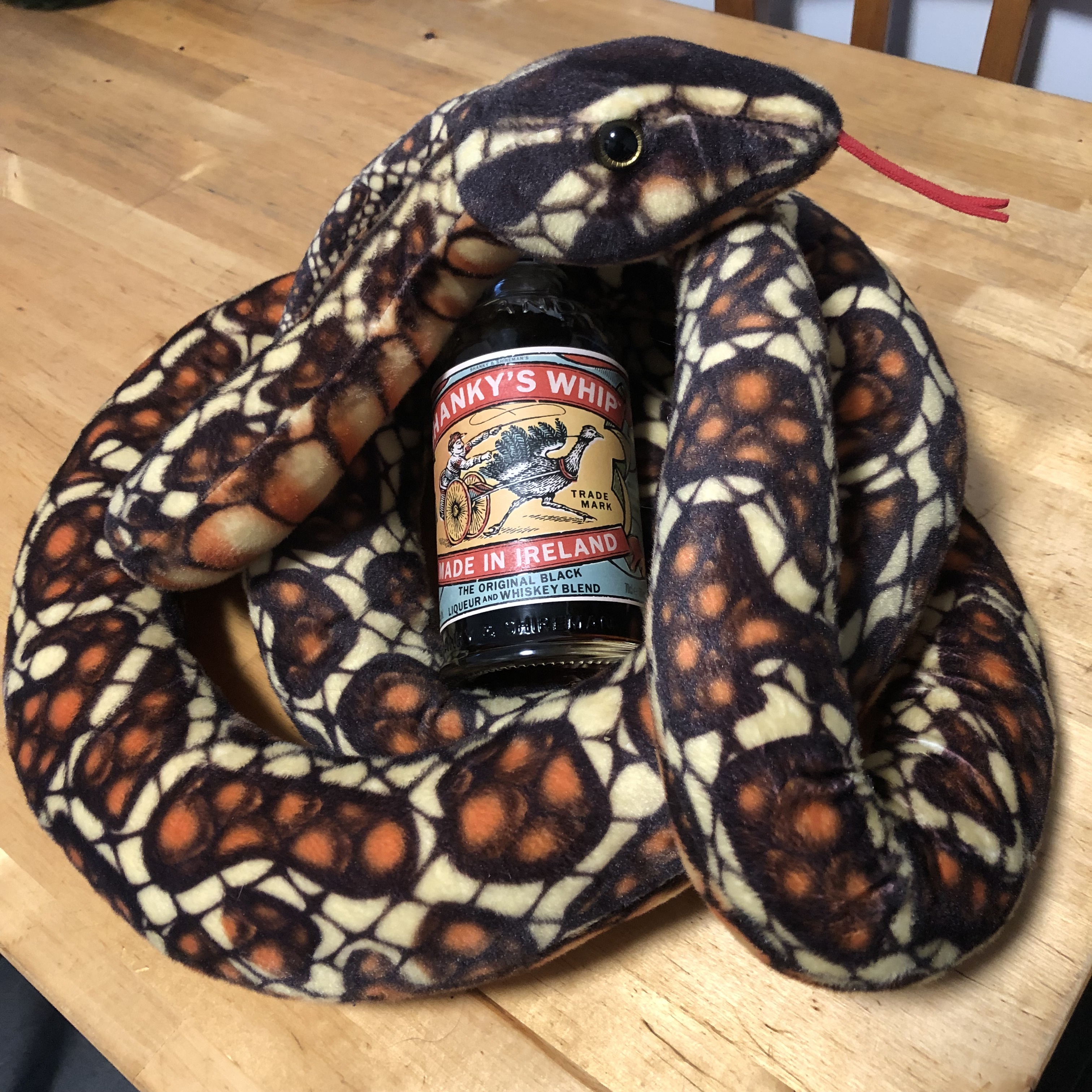 plush snake with whiskey liqueur