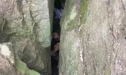 Woman wedged upside down between boulders for seven hours after trying to retrieve phone in regional NSW