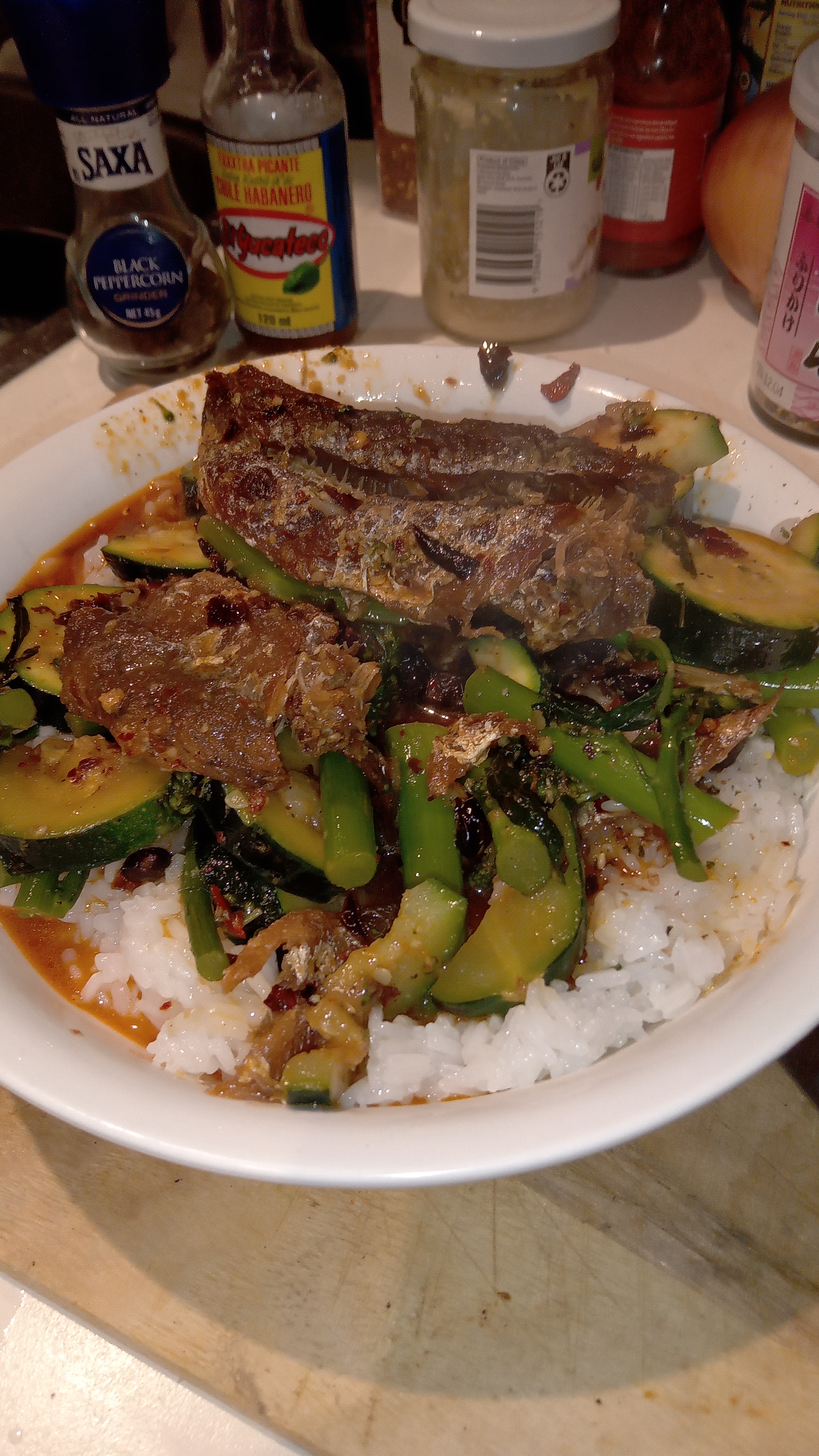 completed dish, dace and black bean with sauteed broccolini and zucchini on white rice with chilli-crisp